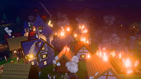 The same village at night, its roofs on fire, with a dragon in the sky above.